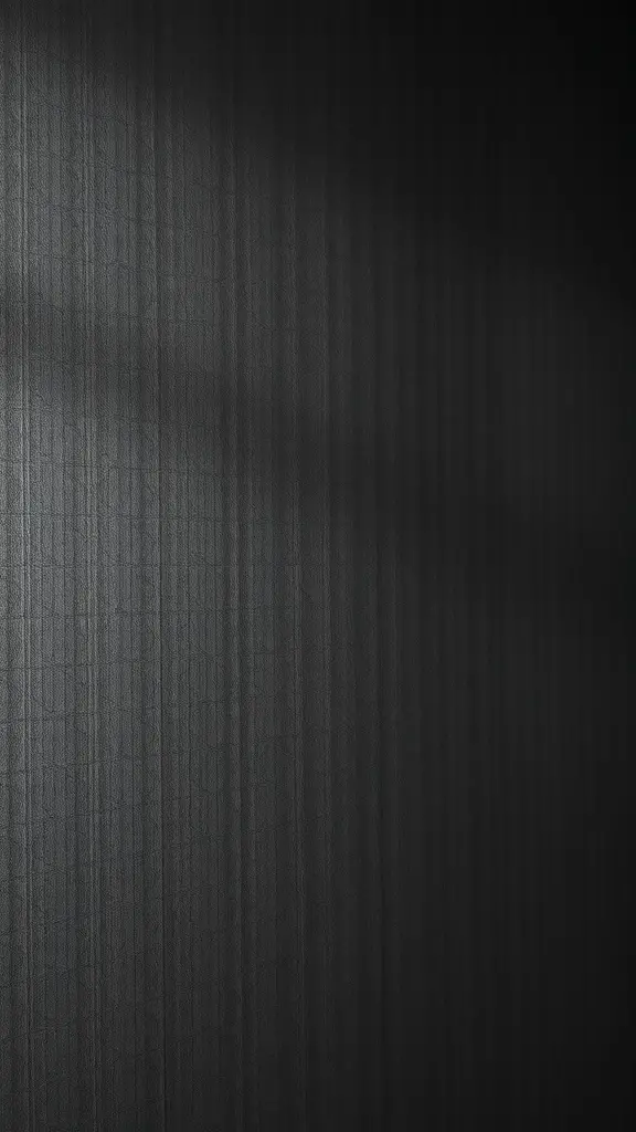 A close-up view of a textured black wallpaper with subtle geometric patterns.