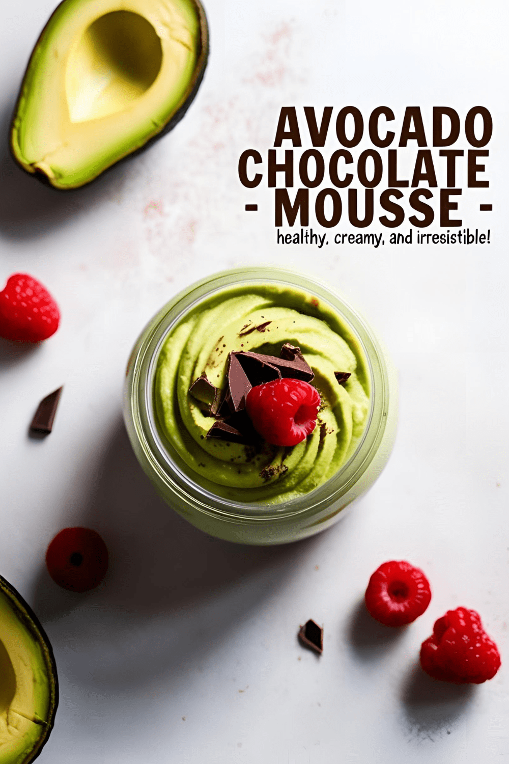 Creamy avocado chocolate mousse served in a glass jar with whipped topping and berries