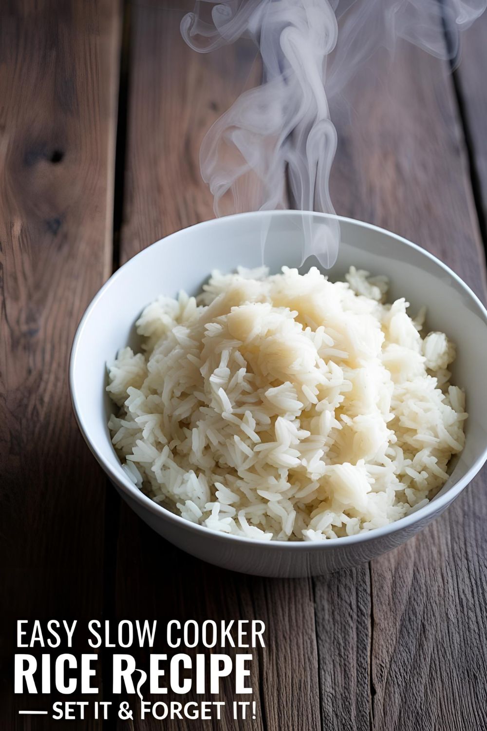 Overhead shot of a bowl of perfectly fluffy white rice, with steam rising, on a wooden table — easy slow cooker rice recipe.