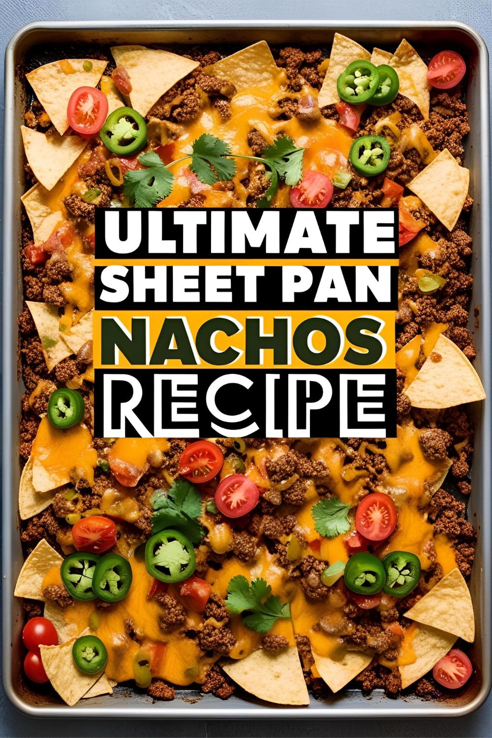 Overhead shot of fully loaded sheet pan nachos with cheese, beef, and toppings, perfect for a party or easy dinner