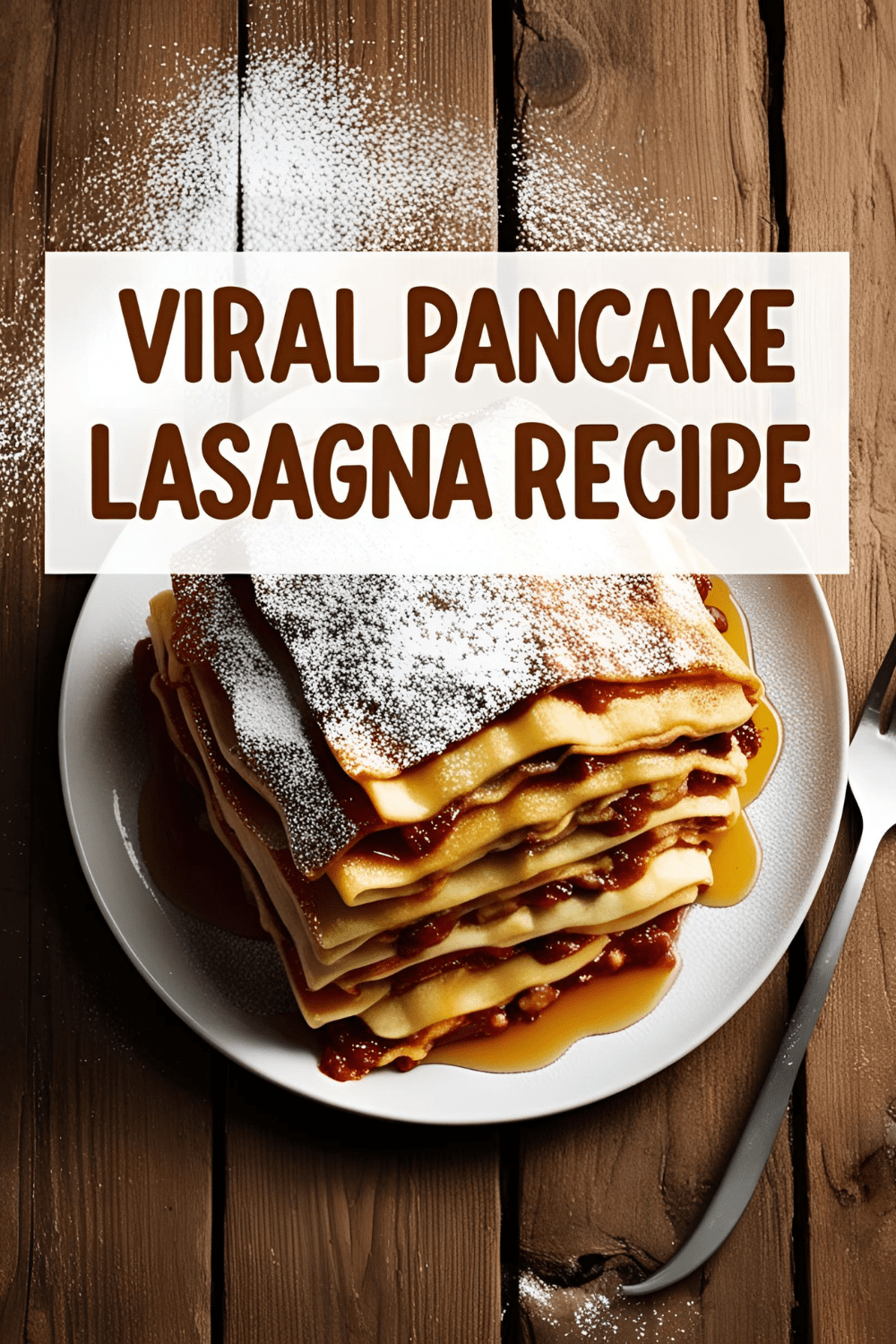 Overhead shot of a layered viral pancake lasagna topped with cream and berries on a wooden table