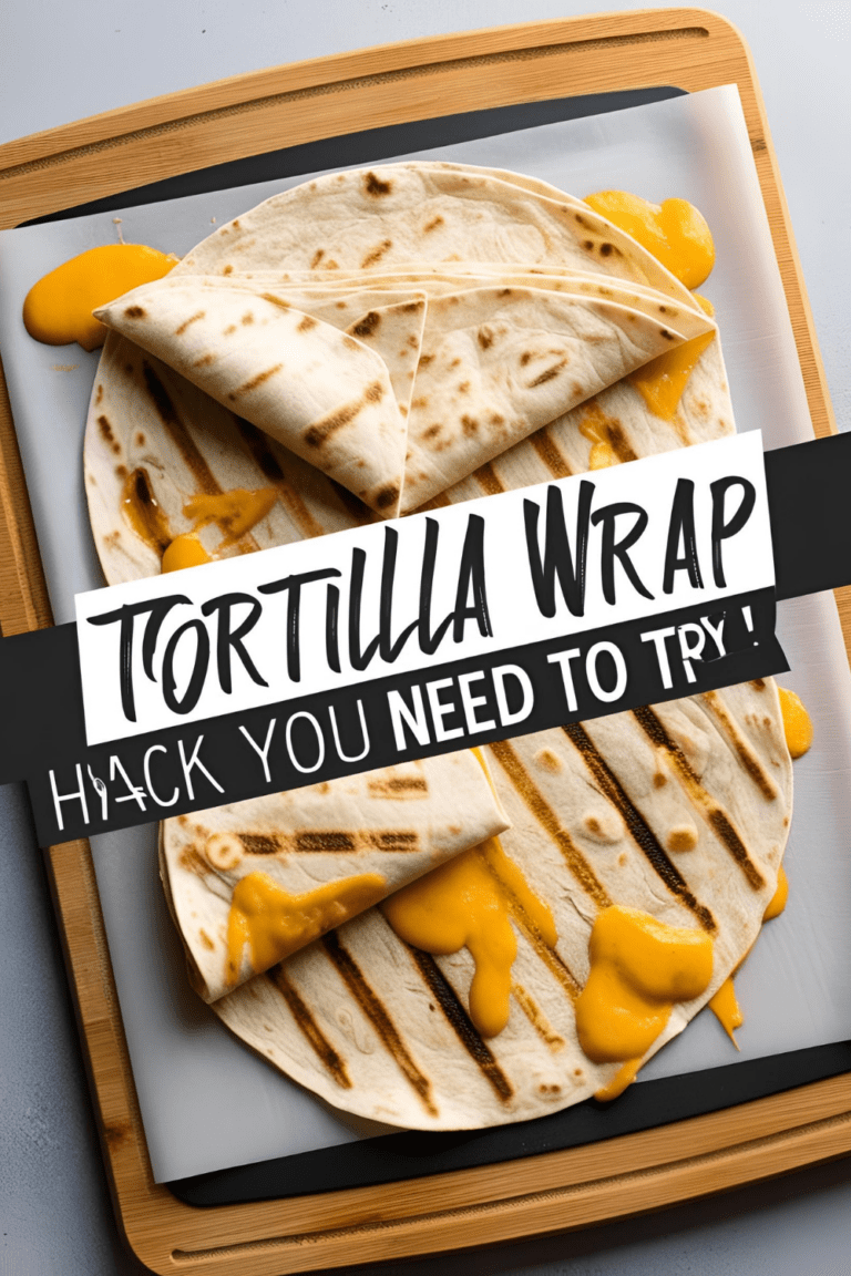 Folded tortilla wrap layered with melty cheese, avocado, chicken and greens on a skillet.