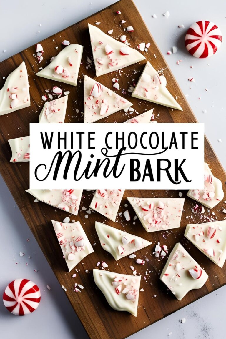 Close-up of white chocolate mint bark pieces sprinkled with crushed peppermint candies.