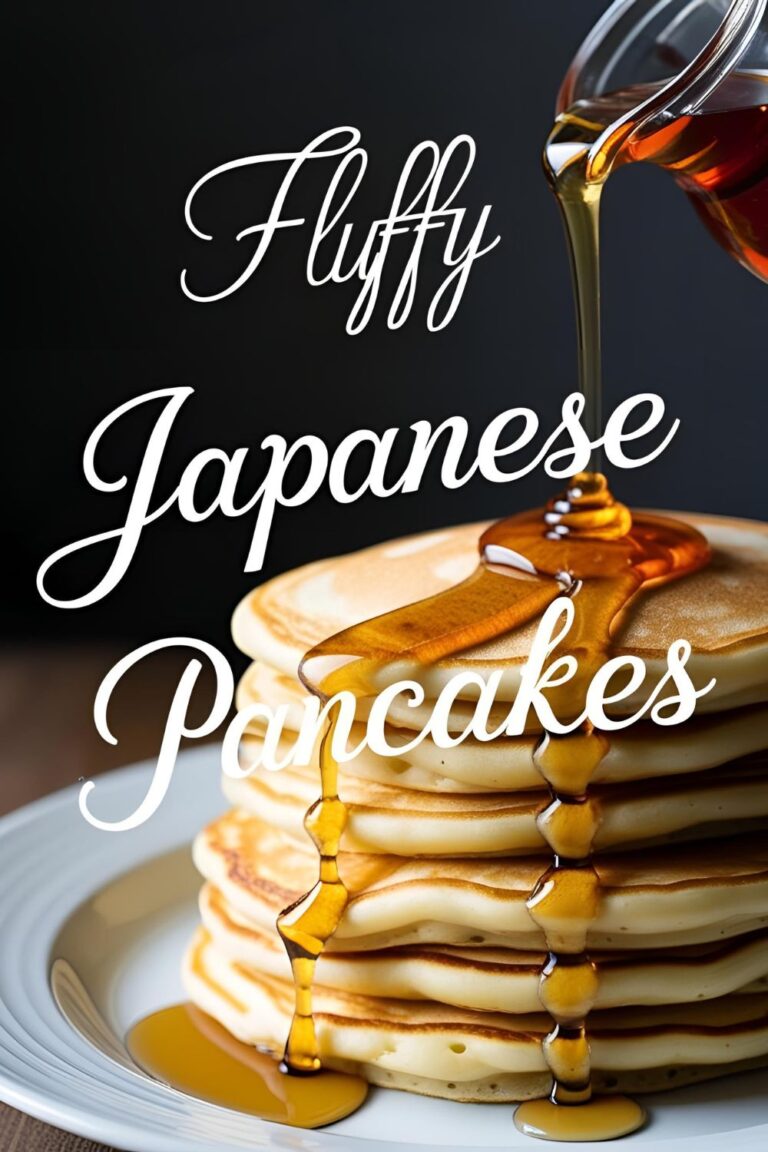 A stack of fluffy Japanese pancakes topped with syrup and berries.