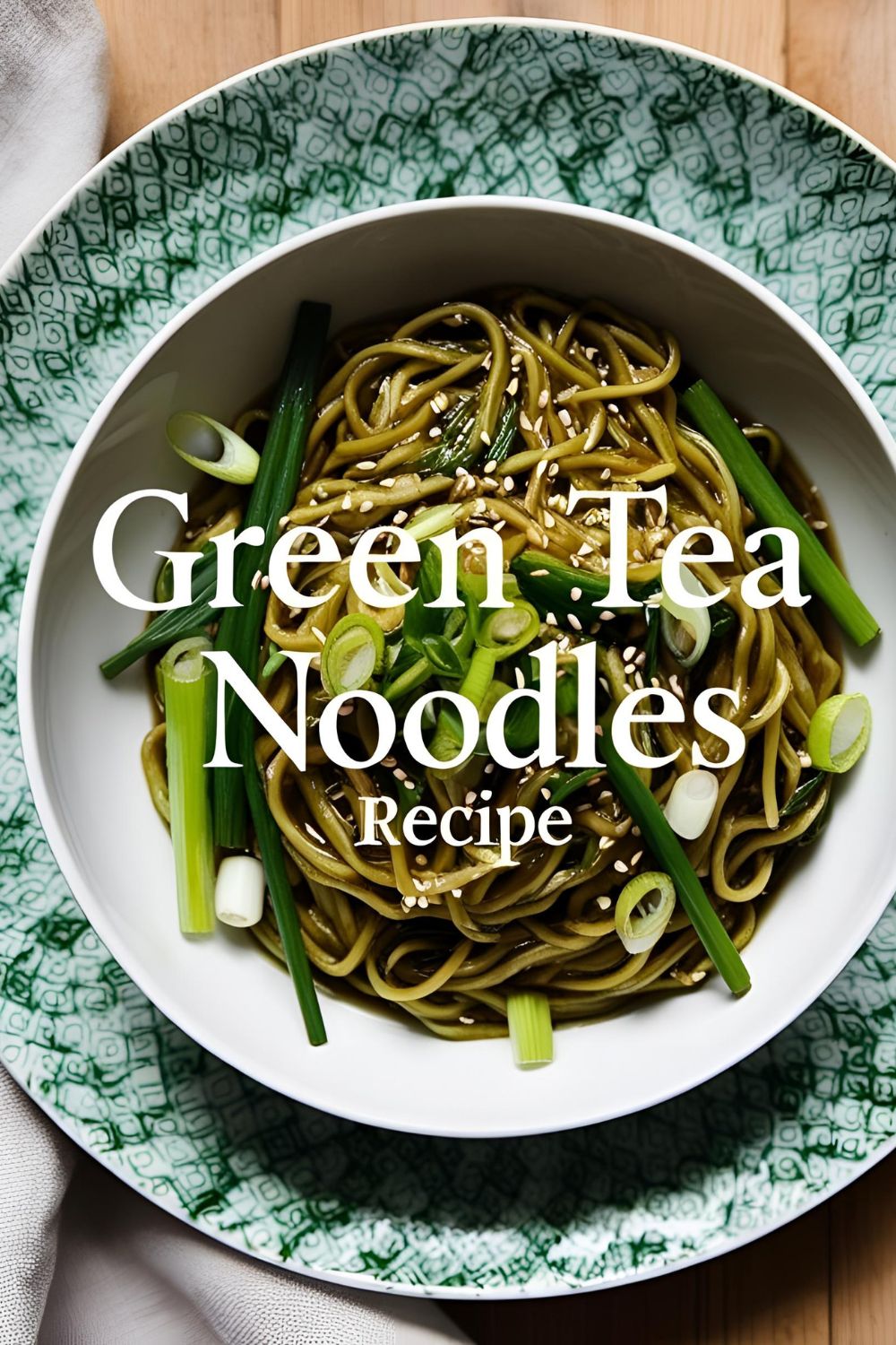 A bowl of green tea noodles garnished with sesame seeds and green onions.