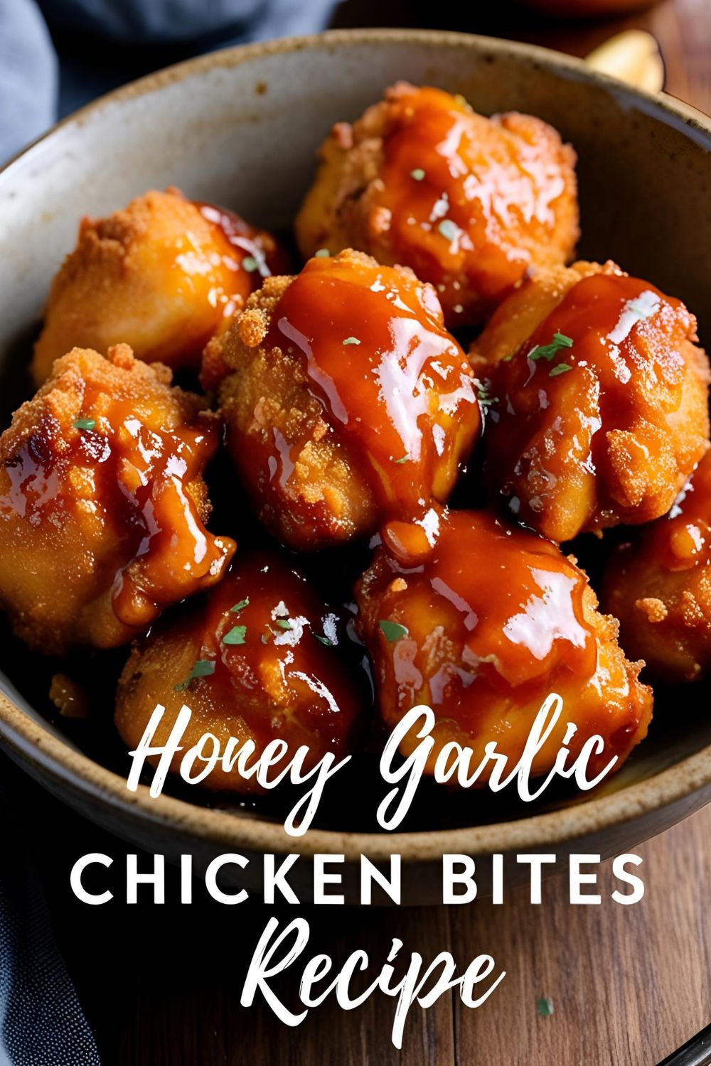 Plate of Honey Garlic Chicken Bites garnished with green onions and sesame seeds.