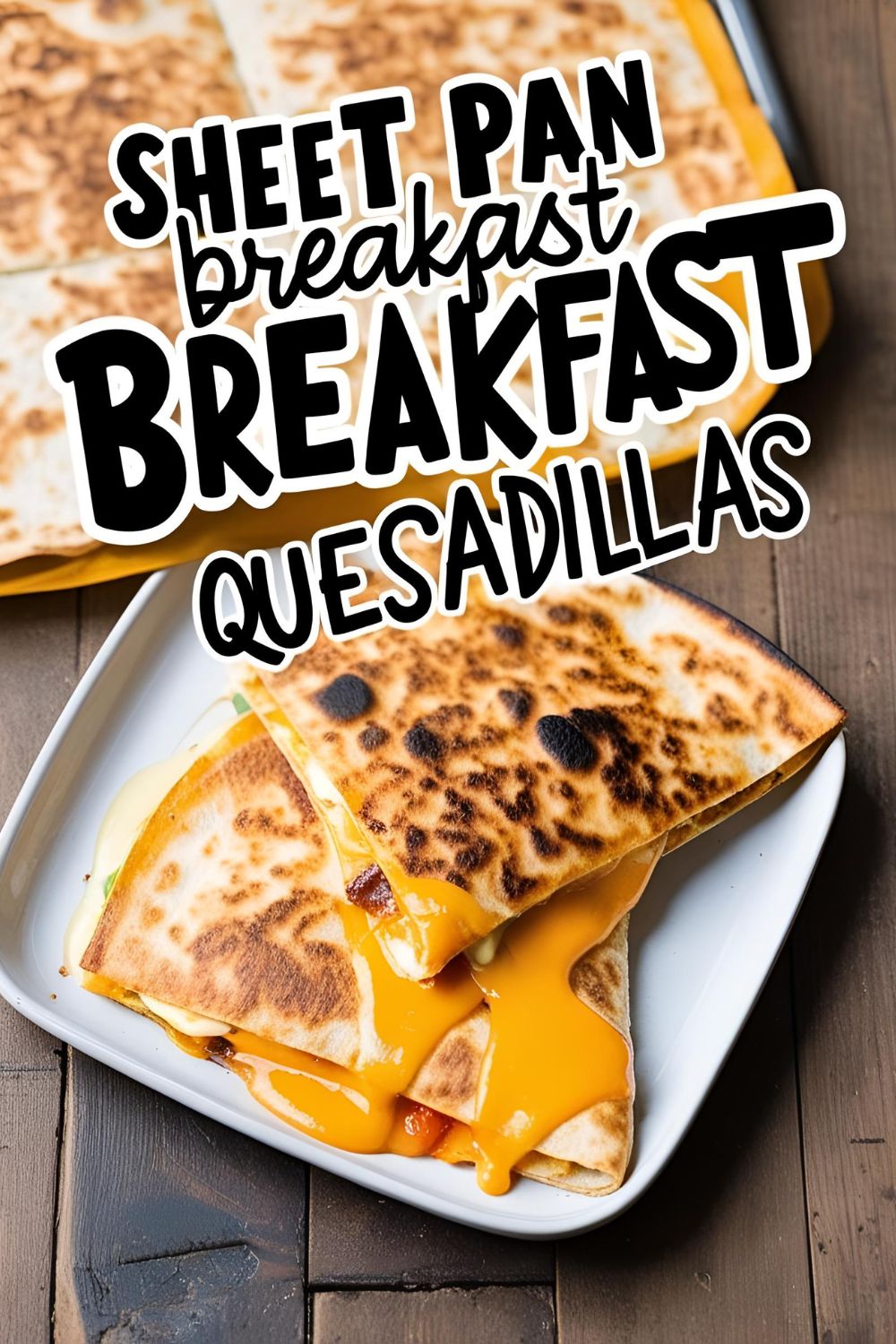 Golden sheet pan breakfast quesadillas sliced and served with toppings.