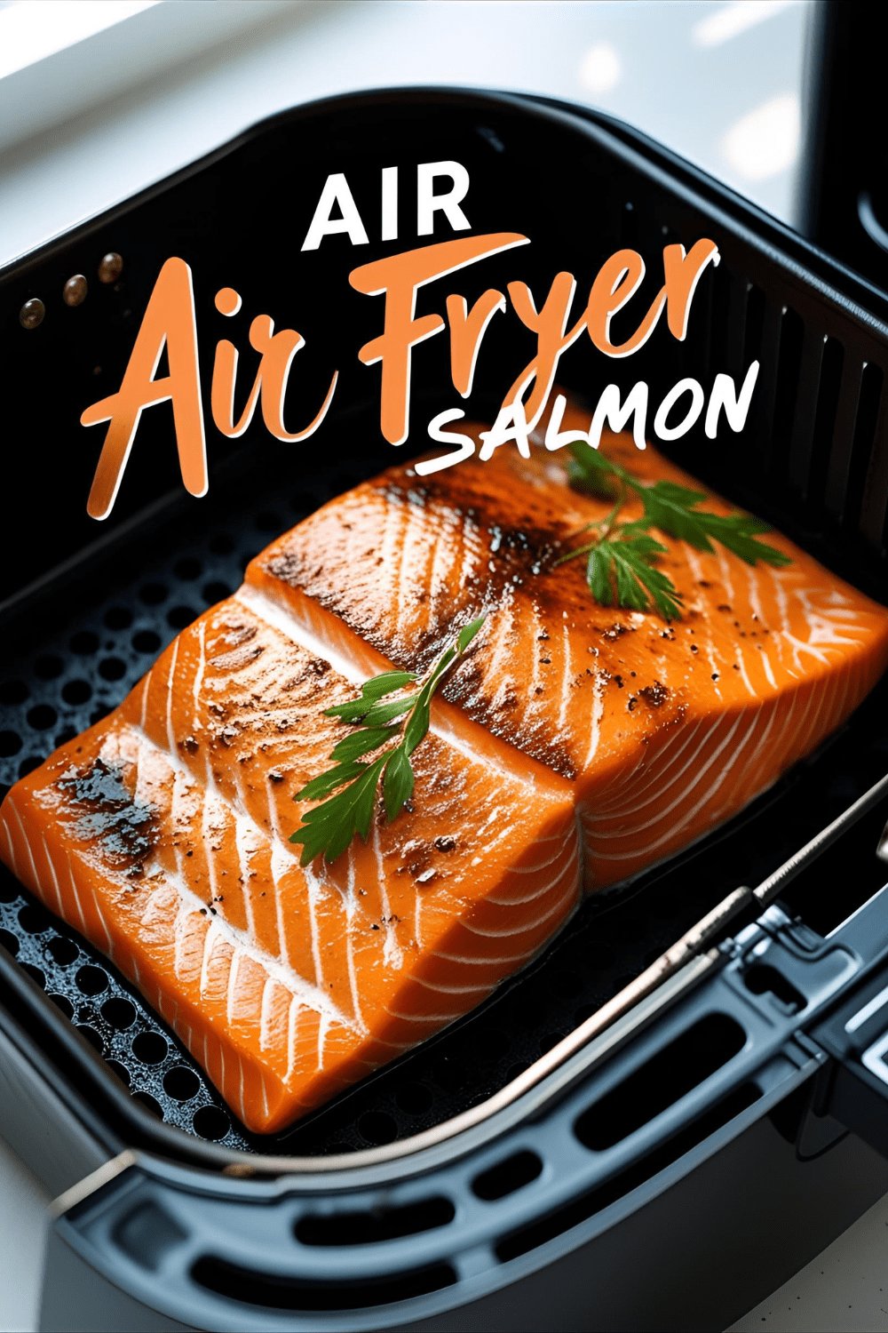 Golden air-fried salmon filet garnished with herbs and lemon wedge