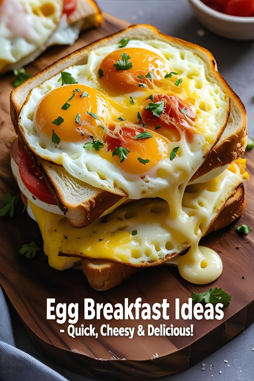 Close-up of sliced cheesy egg breakfast sandwich on wooden board with melted cheese