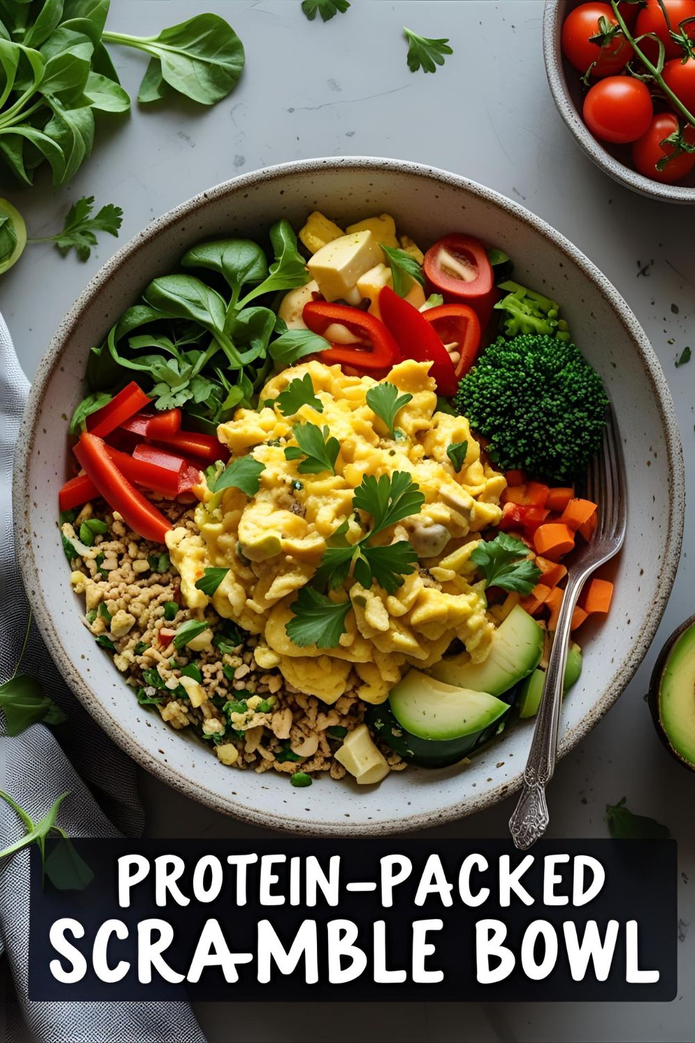 Colorful protein scramble bowl with eggs, veggies, and greens
