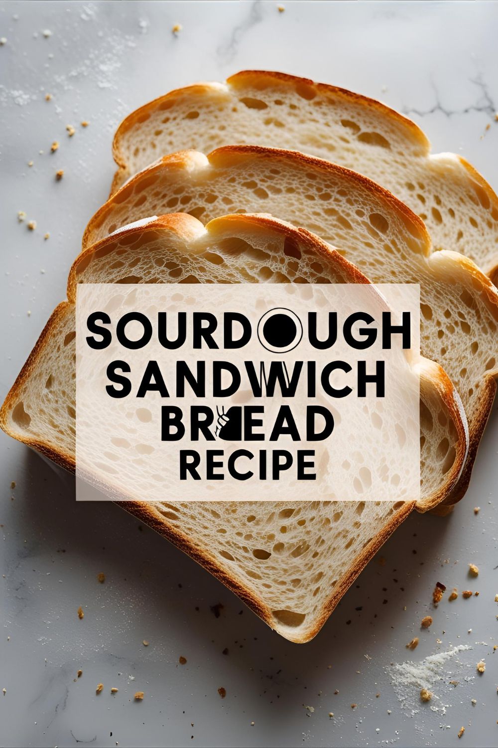 Soft tangy sourdough loaf sliced on cutting board for sandwiches
