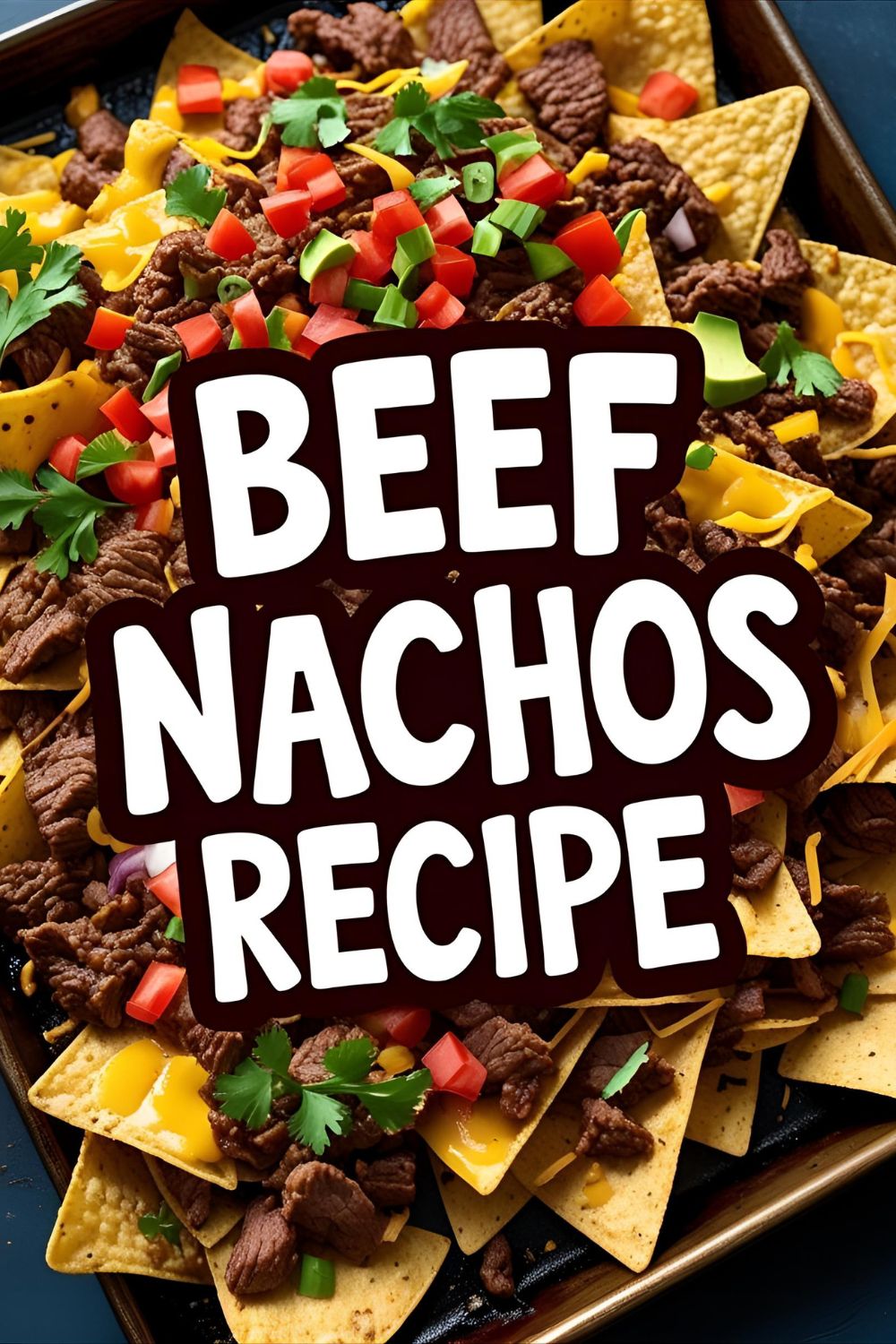 Tray of loaded beef nachos with melted cheese, jalapeños, olives, and cilantro