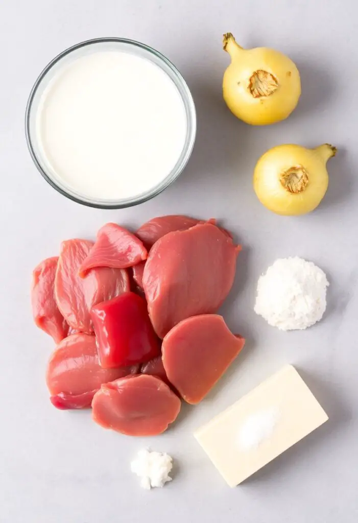 A clean flat lay collage of ingredients for liver and onions: slices of raw beef liver, a bowl of milk, a whole yellow onion, a stick of butter, and a small pile of flour with salt and pepper.