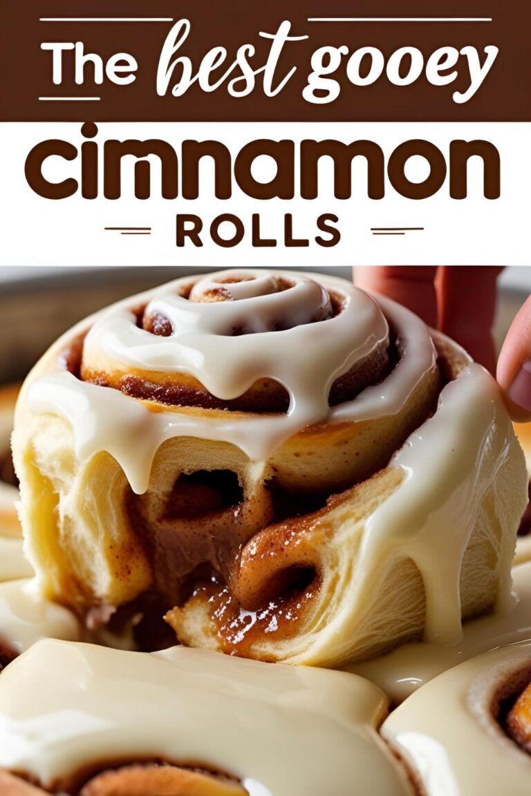 A gooey cinnamon roll being pulled apart with the text overlay "The Best Gooey Cinnamon Rolls."