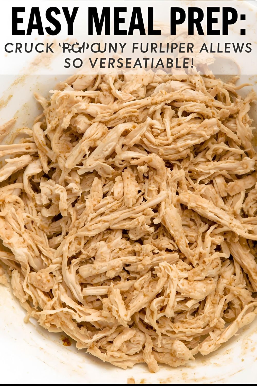 Fluffy crockpot shredded chicken in a bowl with the text "Crockpot Shredded Chicken."