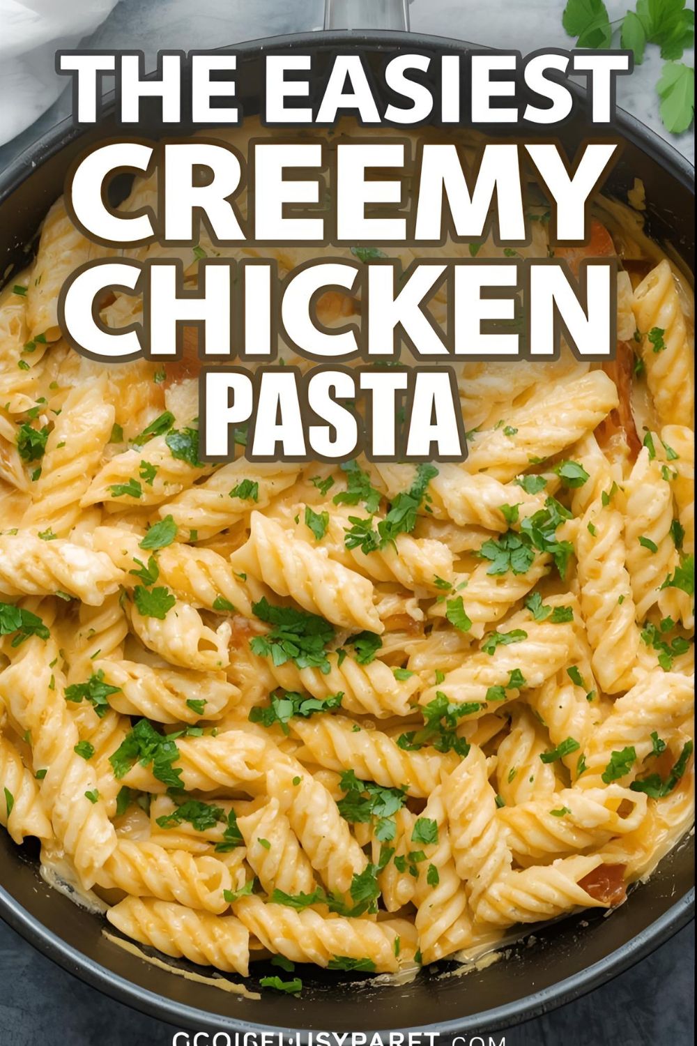 A skillet of creamy chicken pasta with the text overlay "The Easiest Creamy Chicken Pasta."
