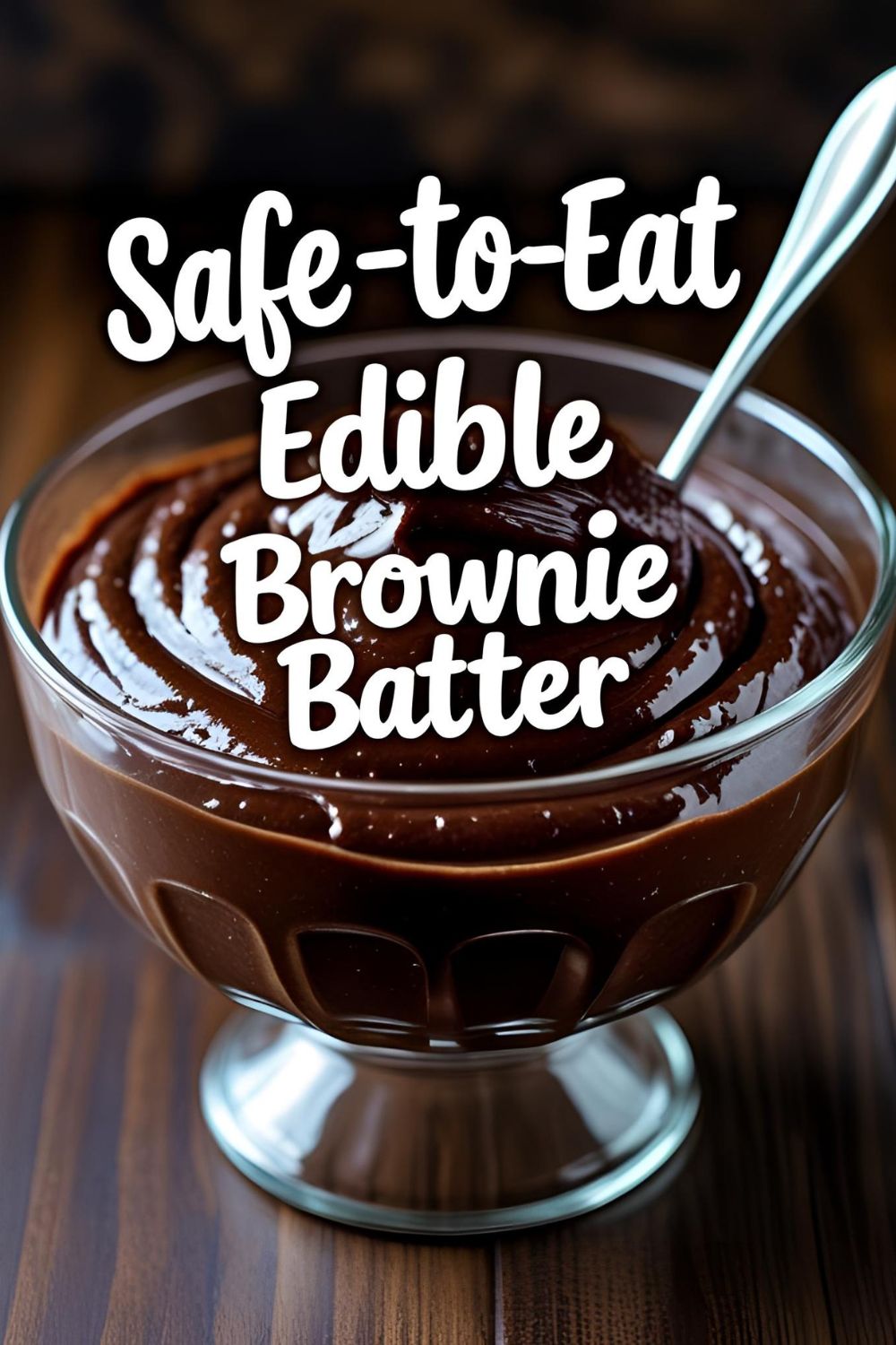 A delicious bowl of safe-to-eat edible brownie batter, studded with chocolate chips and ready to be eaten with a spoon.