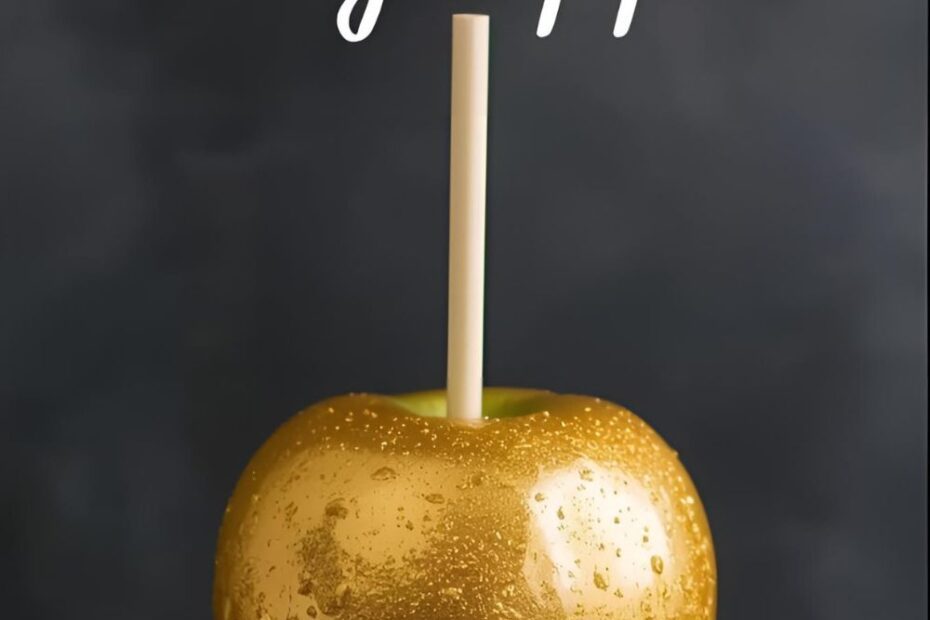 A stunning gold candy apple on a dark background with the text overlay "How to Make Gold Candy Apples."