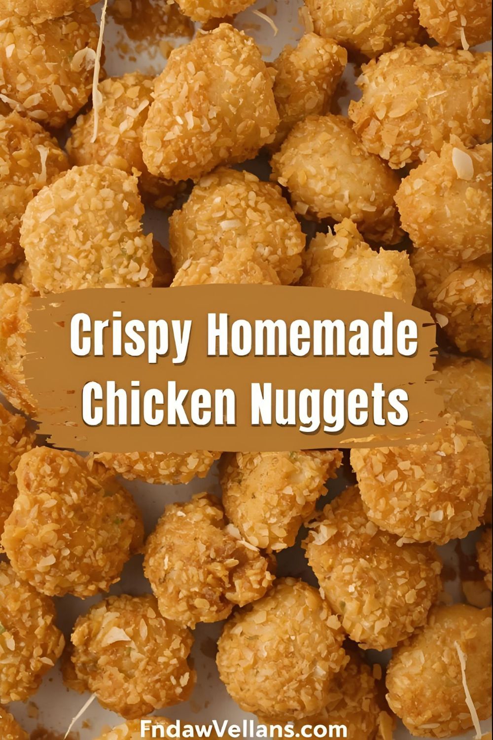 A pile of golden-brown homemade chicken nuggets with the text overlay "Crispy Homemade Chicken Nuggets."