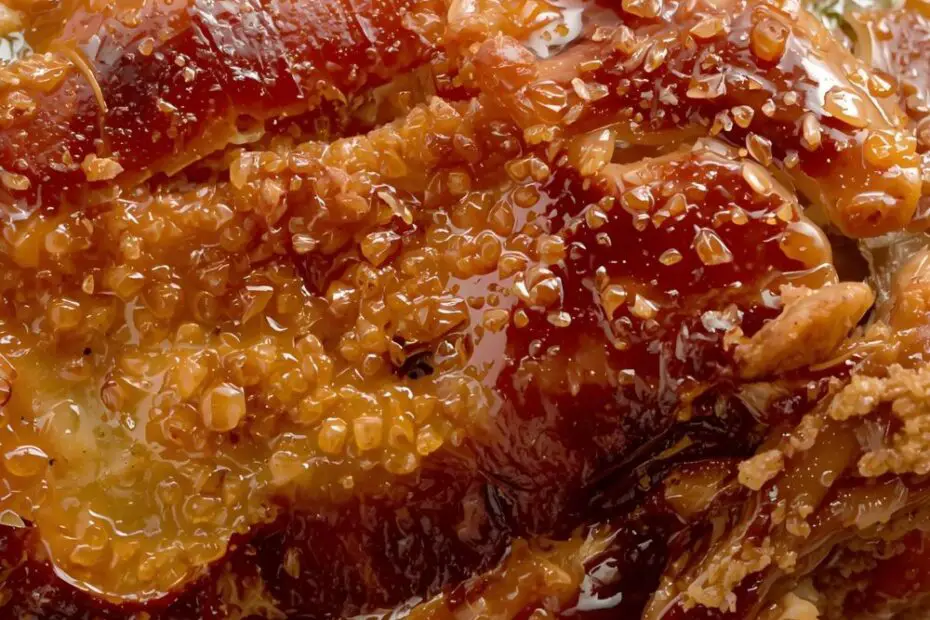 A golden brown, incredibly crispy pata on a wire rack with the text "How to Make Crispy Pata in Oven."