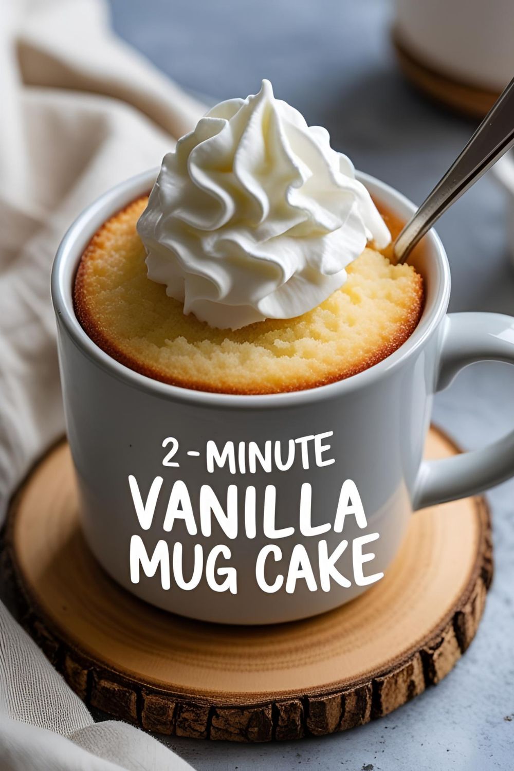 Ingredients for a vanilla mug cake being mixed directly in a single mug, showing the ease of the recipe.