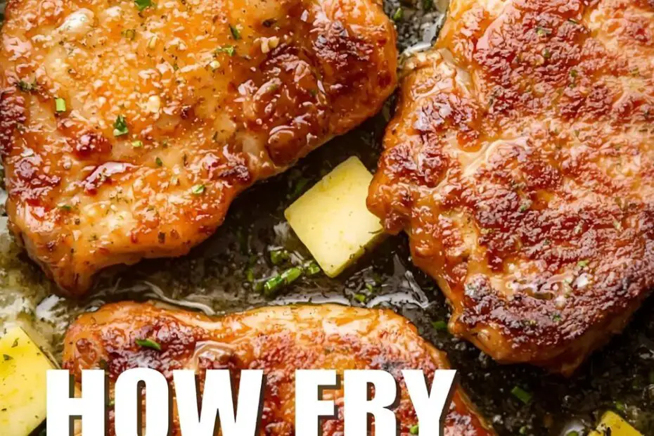 How to Fry Pork Chops in a Skillet" text overlay on a photo of perfectly browned pork chops in a cast iron skillet.