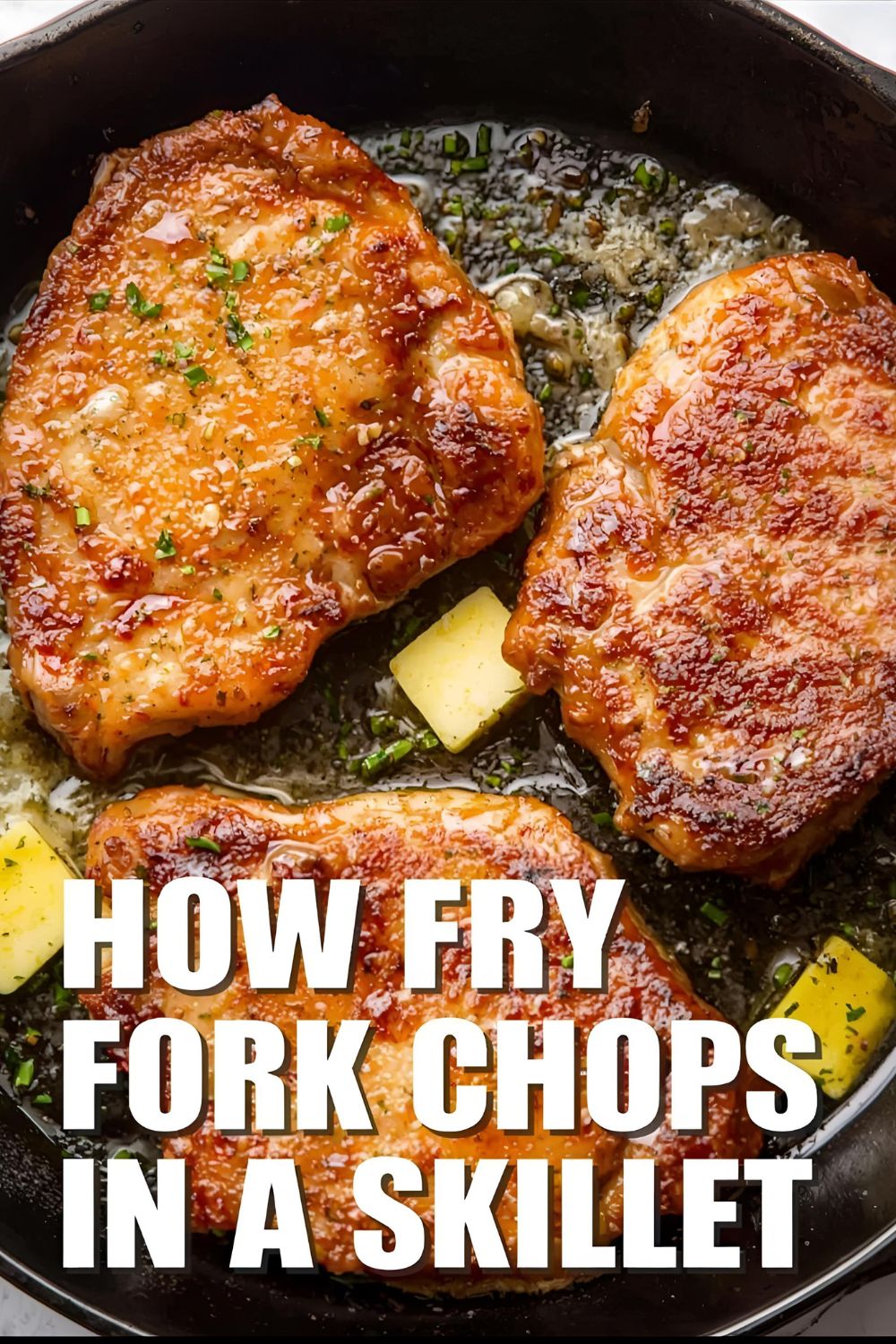 How to Fry Pork Chops in a Skillet" text overlay on a photo of perfectly browned pork chops in a cast iron skillet.