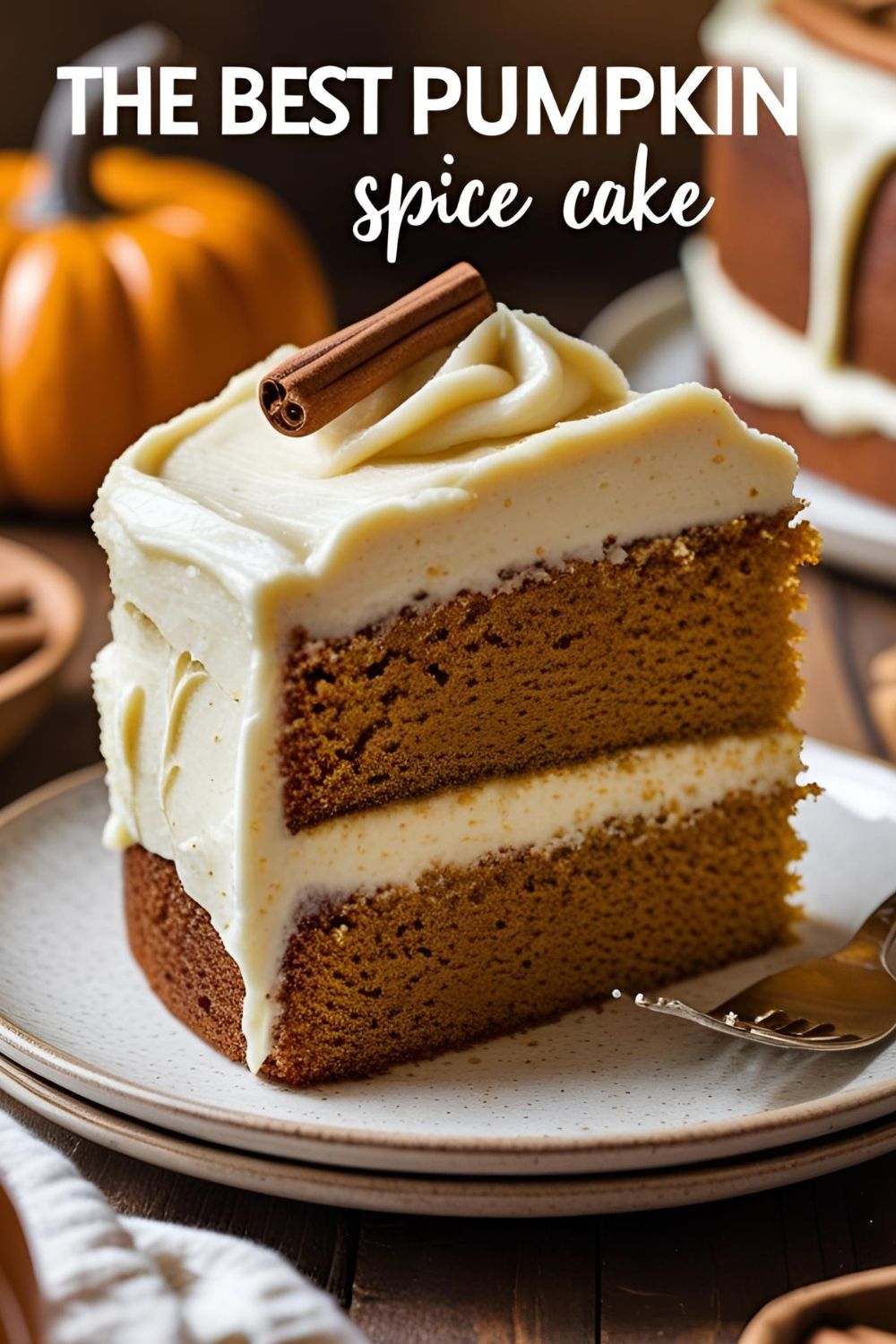 A delicious slice of moist pumpkin spice cake with a thick layer of cream cheese frosting on a plate.